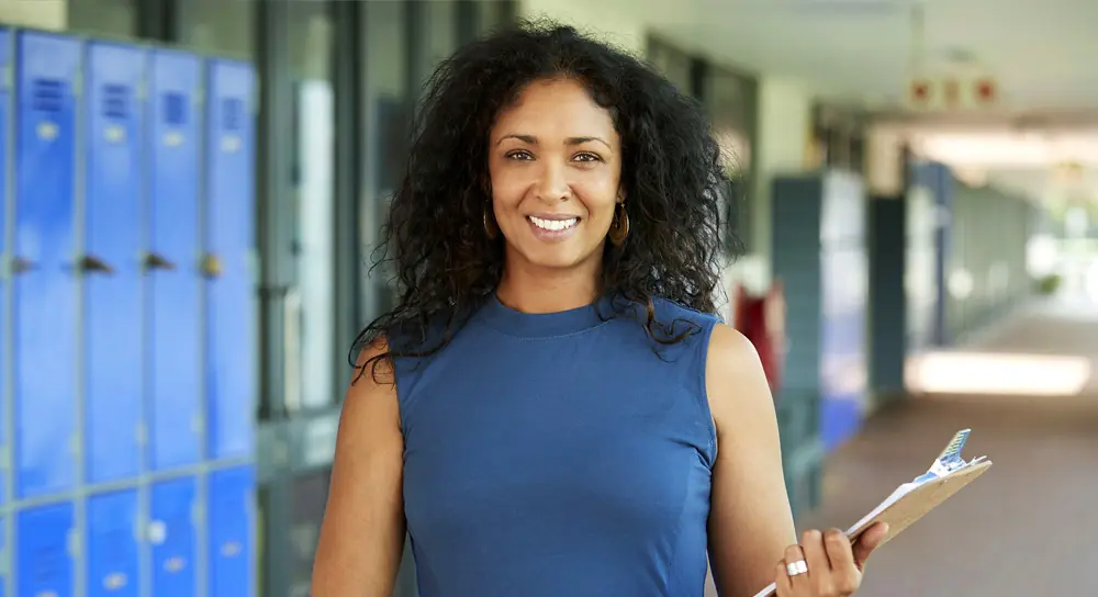 Woman smiling in a hallway